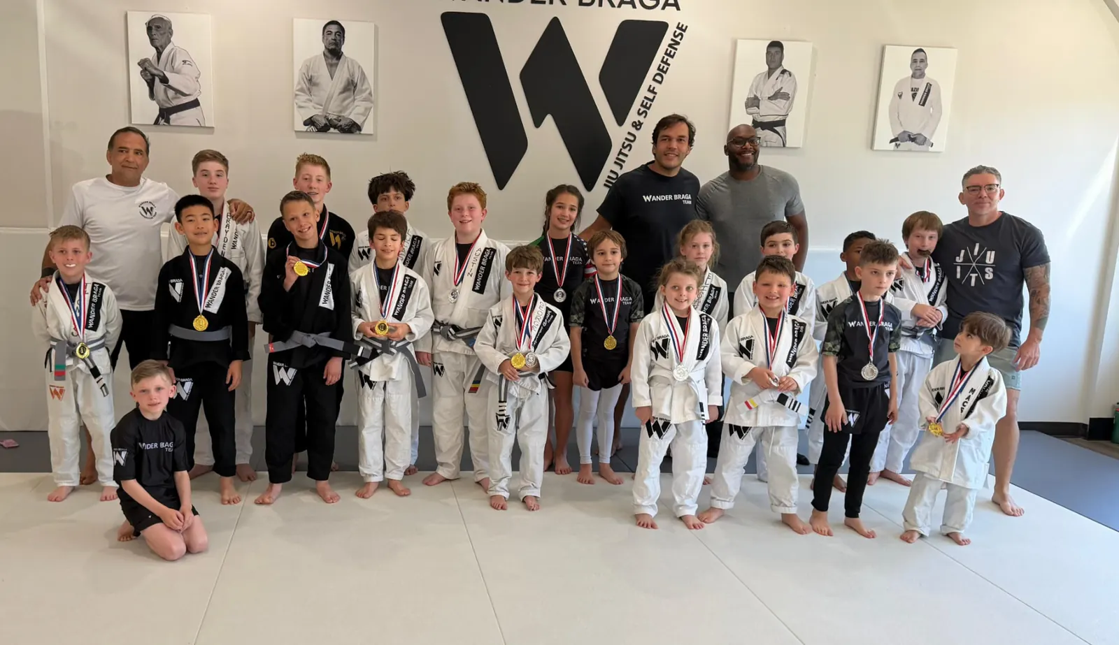 Wander Braga kids team after class in Cornelius, NC with medals and coaches